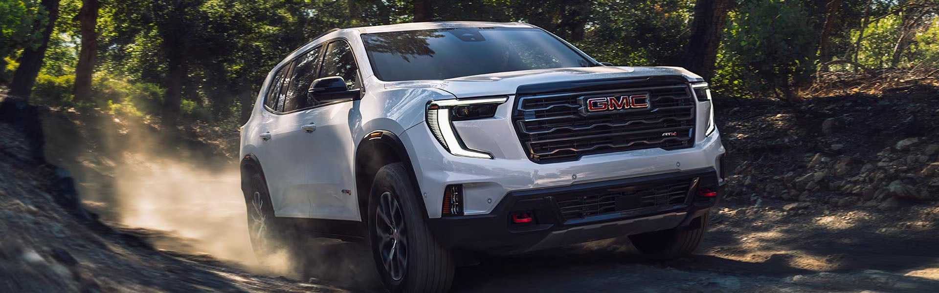 2026 GMC Acadia Elevation SUV exterior driving shot