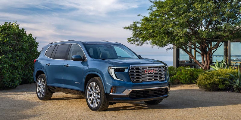 2026 GMC Acadia front view in motion off-road