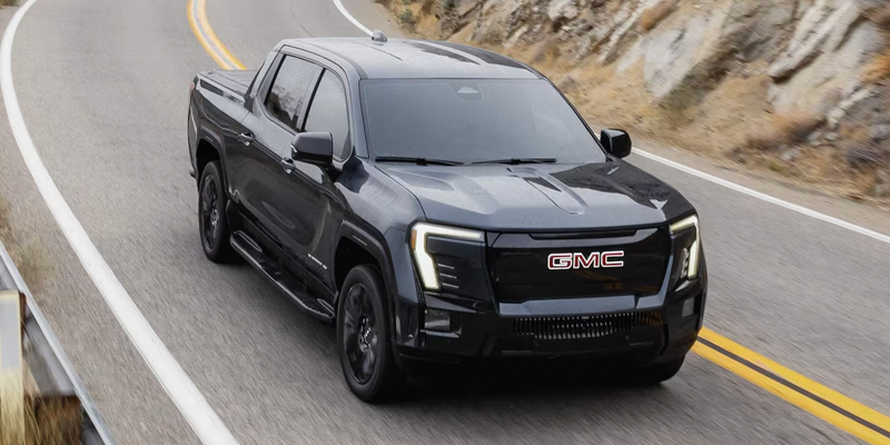 2026 GMC Sierra EV driving on road